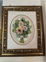 Front view of vintage Capodimonte porcelain framed flower artwork showing detailed floral bouquet and antique gold ornate frame.