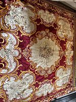 Full view of large rectangular vintage chenille throw blanket with detailed red, gold, and cream Conca D'Oro pattern.