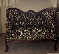 Full view of vintage Victorian floral sofa showing overall condition and design.