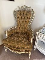Front and side views of the vintage Victorian jacquard armchair showing detailed wood carving and upholstered seat and back.