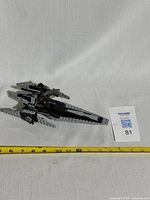 LEGO Imperial V-Wing Starfighter model shown on white surface with measuring tape indicating approx 11 inches long