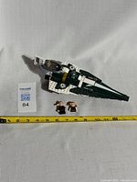 Lego Star Wars Jedi Starfighter with two minifigures beside it, front and aligned with measuring tape showing approximately 12 inches length