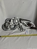 Full side view of the Sky Hook prop with measuring tape showing approximately 22 inches in length.