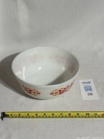 Front view of vintage Pyrex 2.5 qt mixing bowl with Friendship pattern showing decorative exterior design and overall condition.