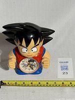 Front angle of the Dragon Ball Z Goku clock showing the full figure and clock face.