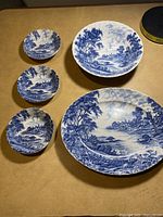 Overview of five Ridgeway dishes showing bowls and plates with blue and white scenic patterns