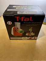 Front box view of T-Fal Fresh Express showing brand and product name, with image of the appliance and produce.