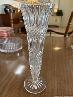 Tall clear crystal vase with diamond and vertical cut glass pattern, fluted trumpet shape