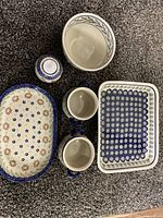 Overview of all ceramic items in set showing patterns and shape