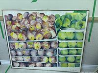Wide view of framed watercolor apple painting, showing subject and frame