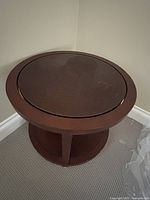 Top view showing round table surface with minor wear marks.