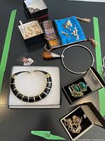 Overhead group shot showing all jewelry items and watch