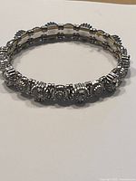 Photo of the full vintage silver-tone stretch bracelet with clear rhinestones in round and square bezels.
