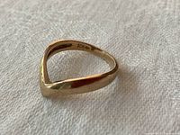 Angled view showing V-shaped top and inner band marking