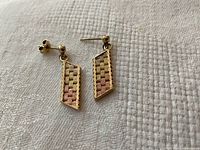 Two drop earrings front view showing geometric pattern