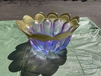 Walther-Glas Marrakech purple and gold art glass bowl photographed outdoors showing color transition and scalloped rim