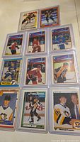 Photo showing twelve hockey trading cards from Topps, O-Pee-Chee, Score. Includes three Jaromir Jagr rookie cards and others like Scott Stevens All-Star Card.