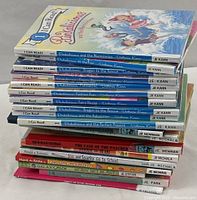 Stack and collection of children's books showing titles and condition