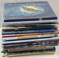 Image showing a stack of 20 children’s books with titles visible on the spines including An Extraordinary Ordinary Day, Woolly and Me, Koala is Not a Bear.