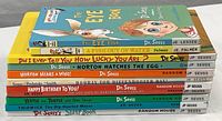 Stack of 11 colorful Dr. Seuss themed children’s books showing titles and authors on spines.