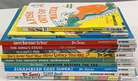 Stacked spines of 11 children’s books showing titles and author names, mostly Dr. Seuss, including one by JE Palmer.