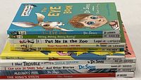Stack of 10 Dr. Seuss hardcover children's books, showing spines and titles including The Eye Book, Put Me in the Zoo, and others.