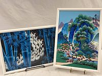 Two Chinese paintings side by side; one with birds and bamboo, the other with a village and mountains.