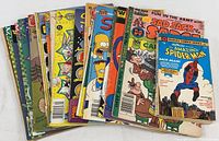 Photo displaying a fan of 19 assorted vintage comic books including Simpsons, Sad Sack, Beetle Bailey, Flintstones, Jetsons, Looney Runes, and others, showing front covers.