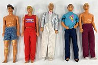 Five male Mattel dolls lined up on a white surface showing different outfits and postures, main image for listing.
