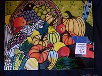 Front view of the colorful ceramic wall tile showing the full cornucopia and vegetable design with a 'maxsold' tag.
