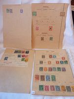 Full view of multiple pages with mounted Panama, Chile stamps and partial envelope front with colorful stamps.