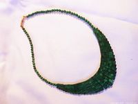 Full view of the green malachite stone necklace showing round bead chain and layered rectangular front.