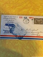 Full view of the commemorative air mail envelope with visible postmark, stamp, and printed aircraft and event details.