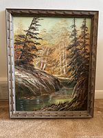 Full view of framed oil painting showing woodland stream with birch trees and evergreen trees.