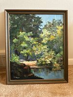 Full view of the original framed oil painting depicting a woodland stream and birch trees.