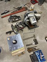 Overview of tools including large red Ridge 36" pipe wrench, electric drill, fishing pole, Rockwell miter box saw, drill bit index, belt sander, hammer and various hand tools.