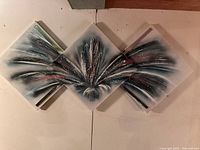 Full view of the vintage abstract triptych art showing three diamond-shaped connected panels with textured blue, white, black and red paint splash.