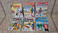 Photo showing seven vintage Archie comics including Laugh Digest Magazine, Archie’s Double Digest, multiple Jughead’s Double Digest issues, and a Jughead Special Series.