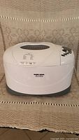 White Black and Decker All-In-One bread maker unit with top lid and brand label visible.