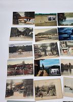 Top view of 14 postcards showing various Japanese landmarks and scenes including temples, bridges, gardens, and countryside views.