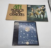 Top down view of the three vintage Avant Garde magazines showing all covers.