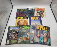 Nine vintage Heavy Metal magazines laid out in two rows, showing various colorful and vivid fantasy and sci-fi inspired cover art featuring humanoid characters, mythical creatures, and surreal scenes.