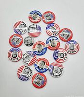 Top-down photo showing 20 round vintage political campaign buttons with mostly red, white, and blue patriotic themes featuring Humphrey, Nixon, Ford, and others