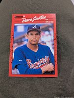 Front of the 1990 Donruss David Justice rookie baseball card showing player portrait in Atlanta Braves uniform with red border.