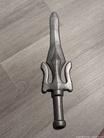 Photo showing the top view of the He-Man Power Sword half, highlighting blade and handle details.