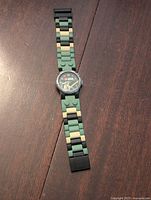 Full view of the LEGO Star Wars Yoda watch laid flat, showing the band and watch face.