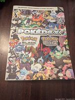 Front cover of the Official Unova Pokedex & Guide Volume 3 featuring various Pokemon from Black and White versions.