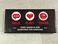 Black rectangular box for Talk Flirt Dare game with icons and game description on top.