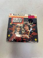 Front view of the sealed View-Master Mork & Mindy K-67 3D picture packet showing the original shrink wrap and colorful retro design.