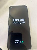 Photo of Samsung Galaxy A11 boot screen showing brand and model confirmation